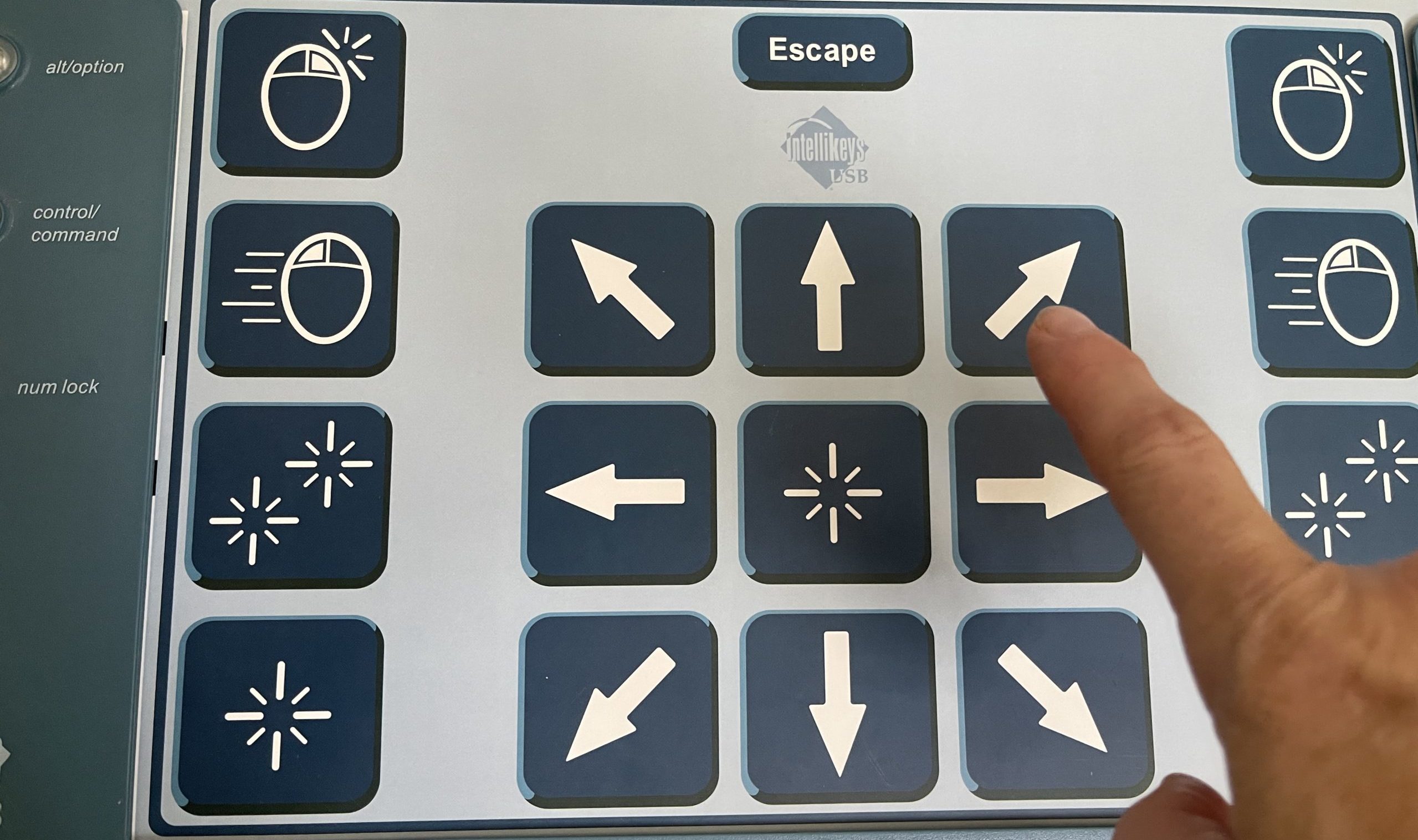finger pointing at the intellikeys keyboard